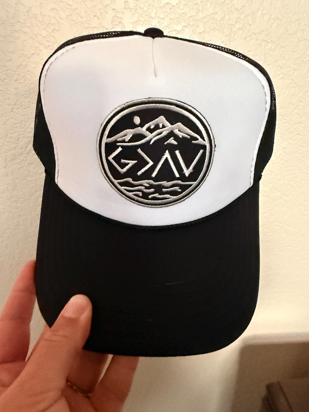 God is Greater black and white Trucker Hat